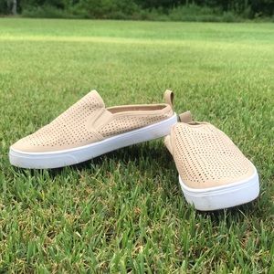 Cream colored slip on sneakers